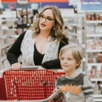 Business Mentor and Mom Sara Drury shopping with her son.